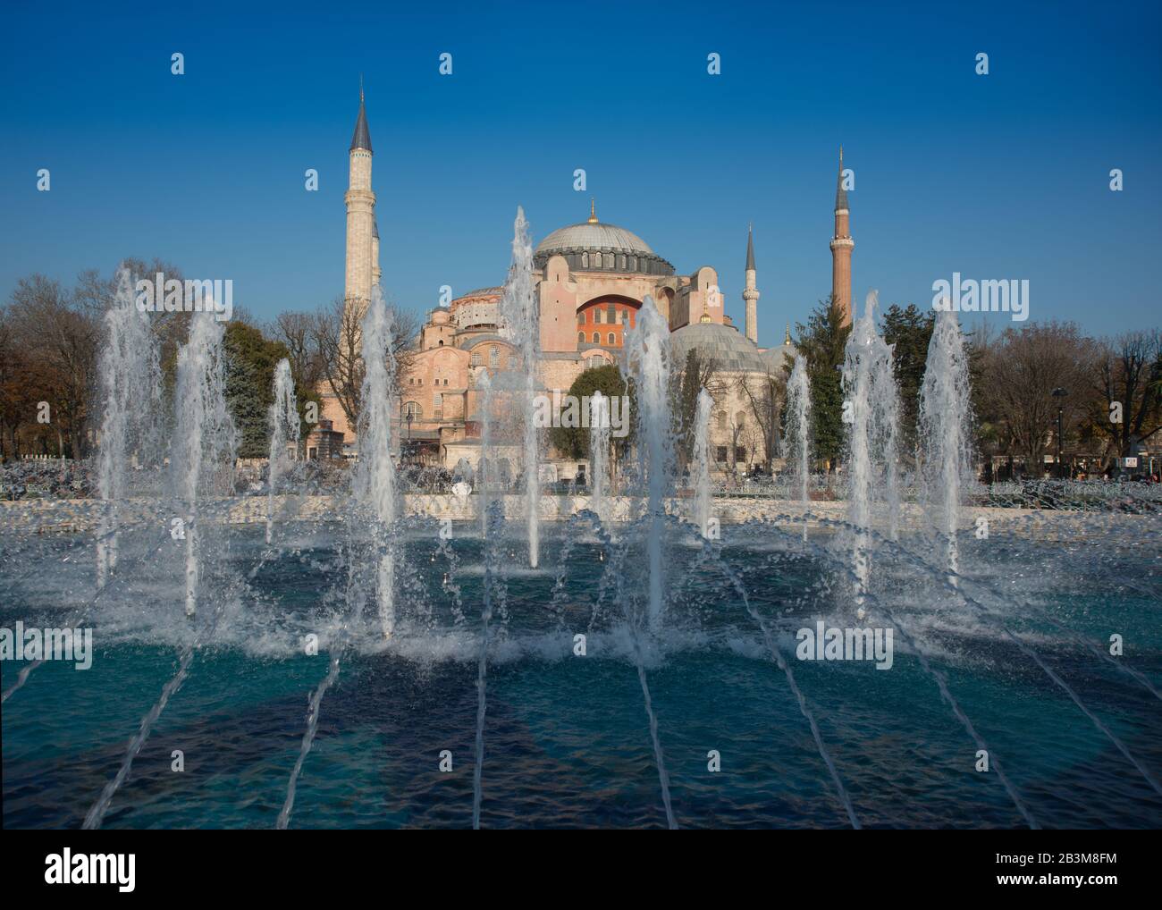 Hagia Sophia (Turkish: Aya Sofya) is a former Orthodox patriarchal basilica, later a mosque, and now a museum in Istanbul, Turkey. Fountains and blue Stock Photo