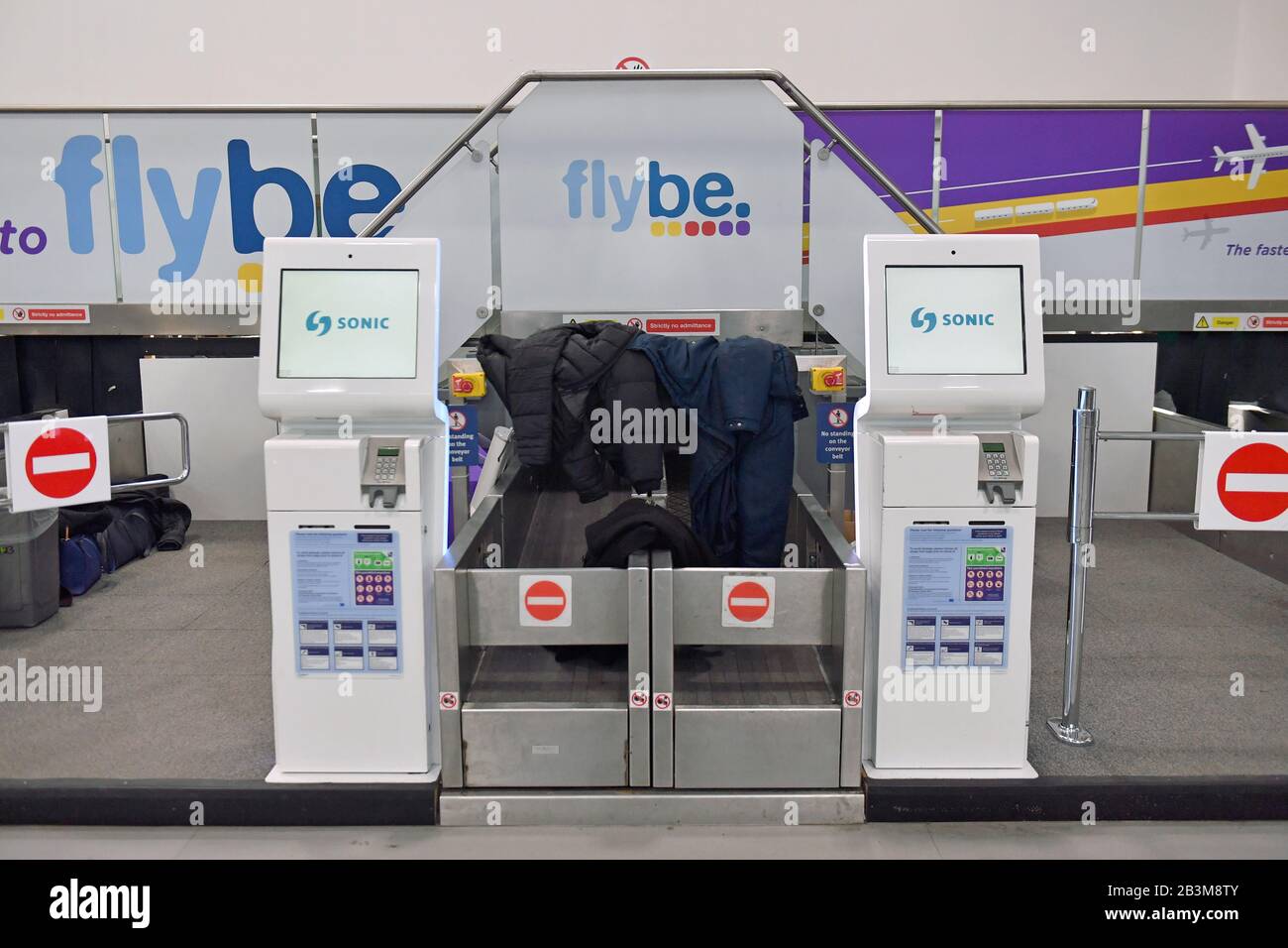 Jackets and coats left at theFlybe check-in desks at Birmingham International Airport as Flybe, Europe's biggest regional airline, has collapsed into administration. Stock Photo