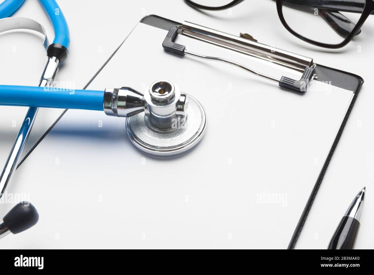 Blank medical clipboard with stethoscope on white background Stock ...