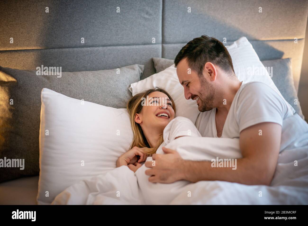 Happy Couple Sleeping In Bed At Home Young Cute Couple Sleeping Happy Couple Sleeping In Bed At Homeyoung Cute Couple Sleeping Together In Bedromantic Moments 2B3MCRF