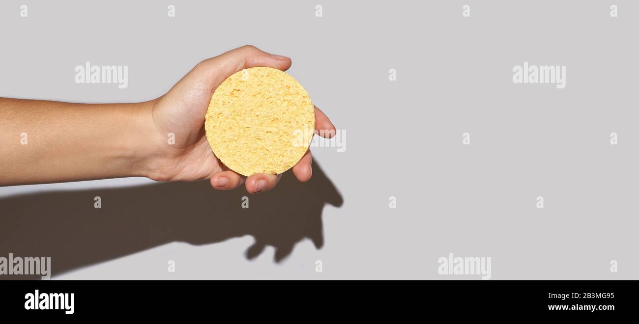 Remove makeup pad. Yellow cosmetology skin care routine Stock Photo