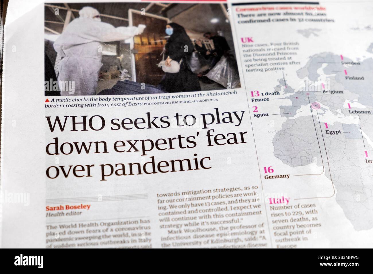 'WHO seeks to play down experts' fear over pandemic' coronovirus covid 19  Guardian newspaper article headline in London England UK February 2020 Stock Photo