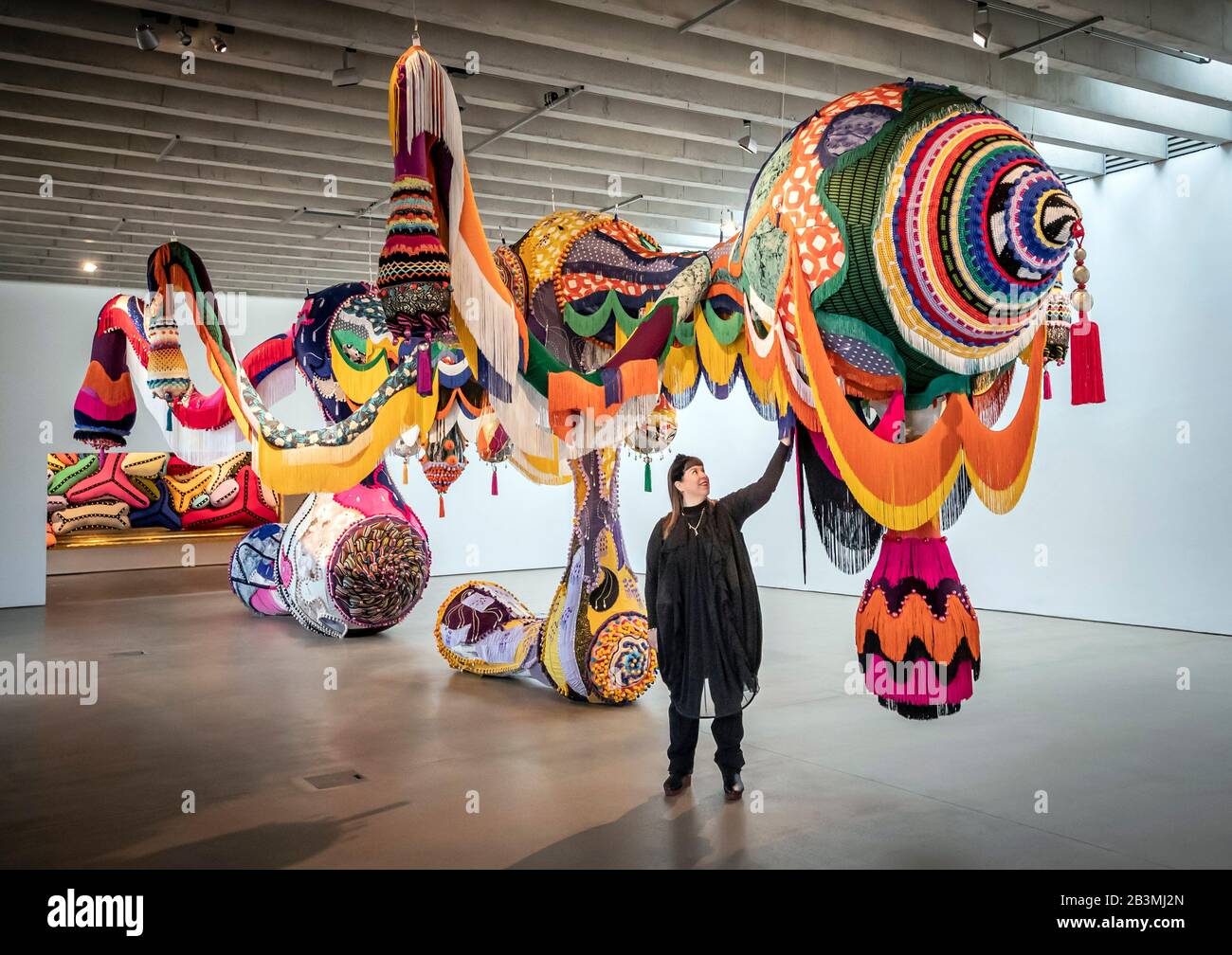 Artist Joana Vasconcelos with her work titled Valkyrie Marina Rinaldi, 2014, that forms part her largest UK exhibition to date, Beyond, at Yorkshire Sculpture Park. Stock Photo