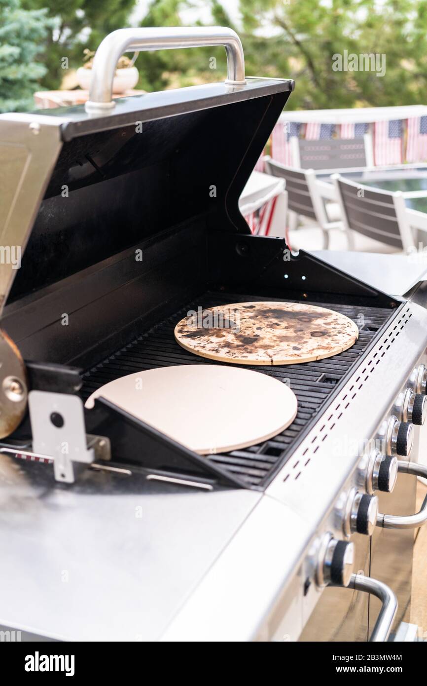 Preheating pizza stones on an outdoor gas grill Stock Photo Alamy