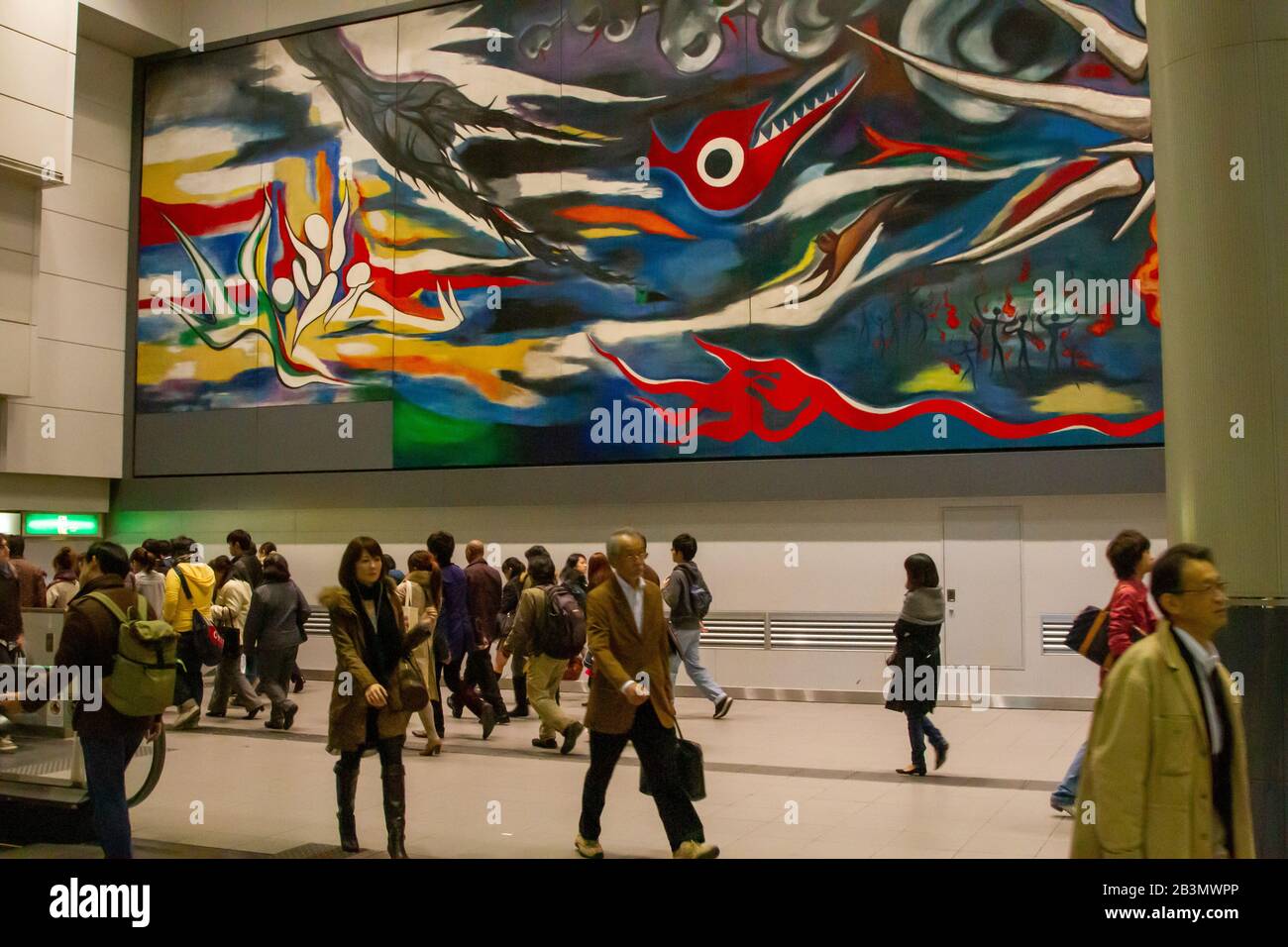 Interior of Shibuya train Station in Tokyo, Japan a mural by Taro Okamoto, 'The Myth of Tomorrow' in the background Stock Photo