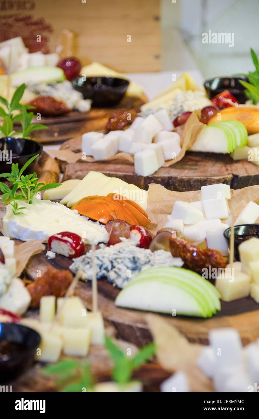 Finger food, snacks and various cheese sandwiches laid out on a table Stock Photo