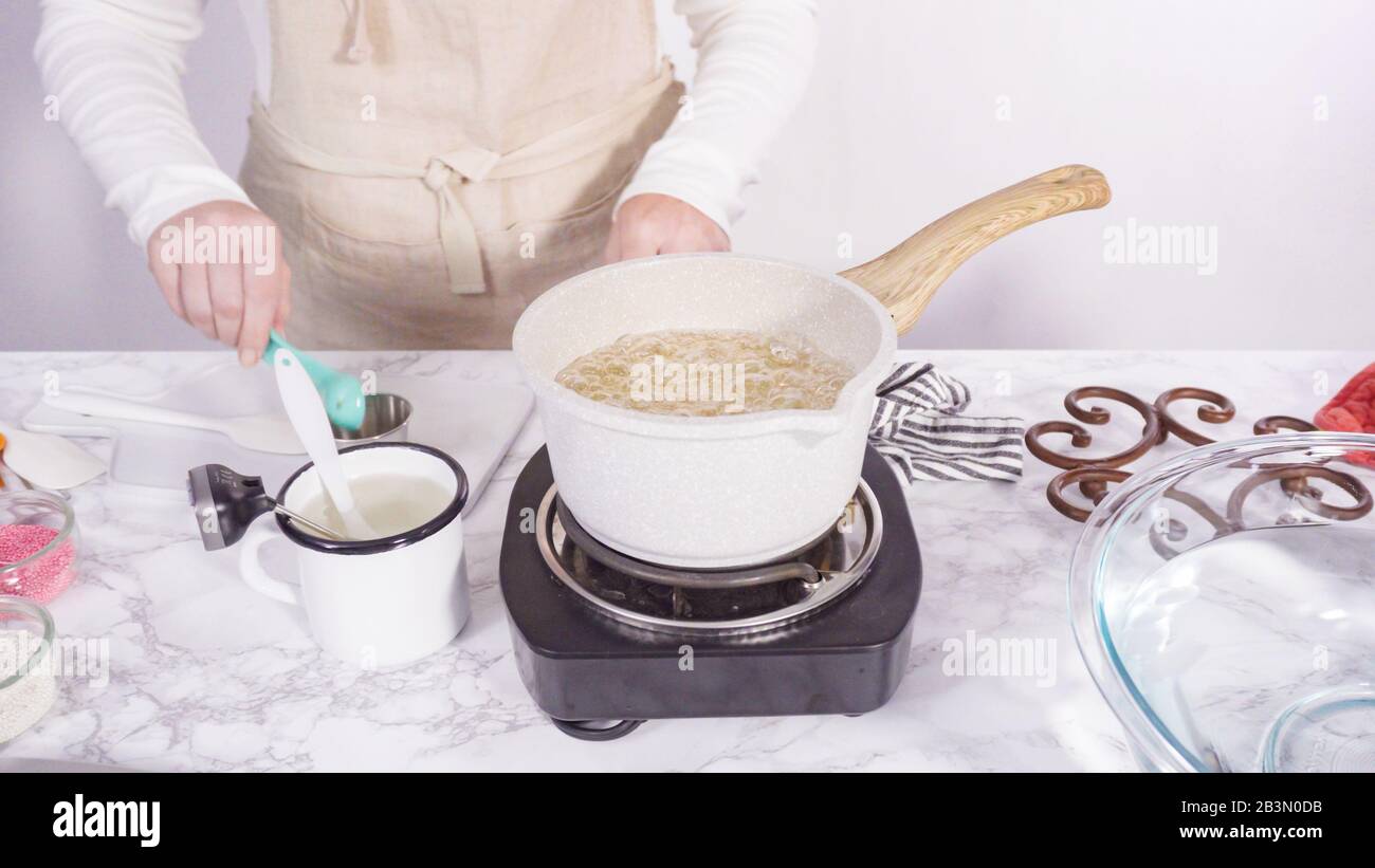 Step by step. Caramelizing sugar in a small cooking pot over the small