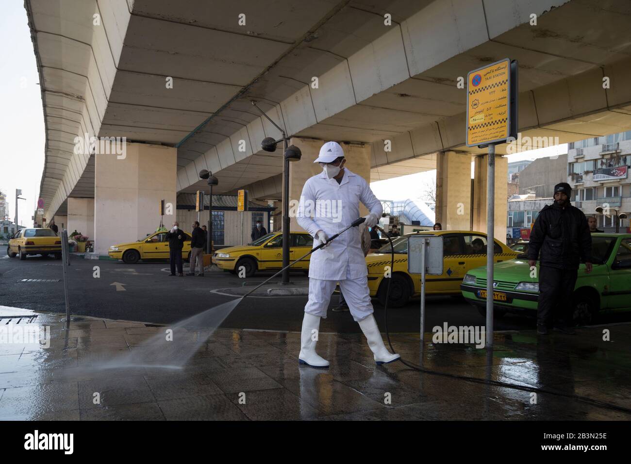 March 5, 2020, Tehran, Iran: Iranian firefighters and municipality workers disinfect a street because of the new coronavirus (COVID-19) in northern Tehran, Iran. Iran today reported 15 new deaths from the novel coronavirus and 591 fresh cases in the past 24 hours, bringing the toll to 107 dead and 3,513 infected. Iran has one of the highest death tolls in the world from the new coronavirus outside of China, the epicenter of the outbreak. (Credit Image: © Rouzbeh Fouladi/ZUMA Wire) Stock Photo