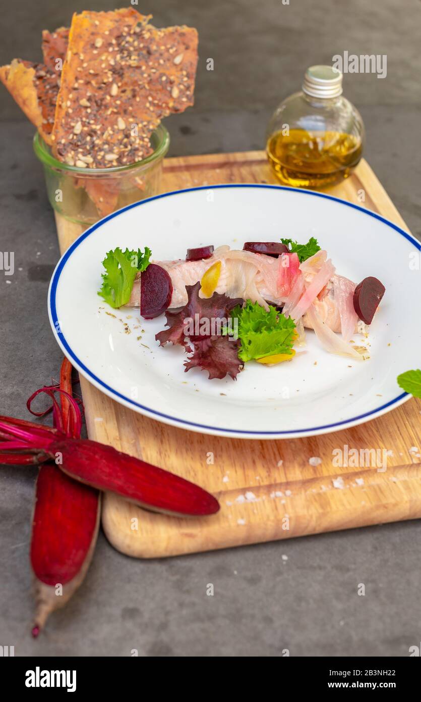 Gourmet salmon starter dish served at rustic Italian restaurant Stock Photo