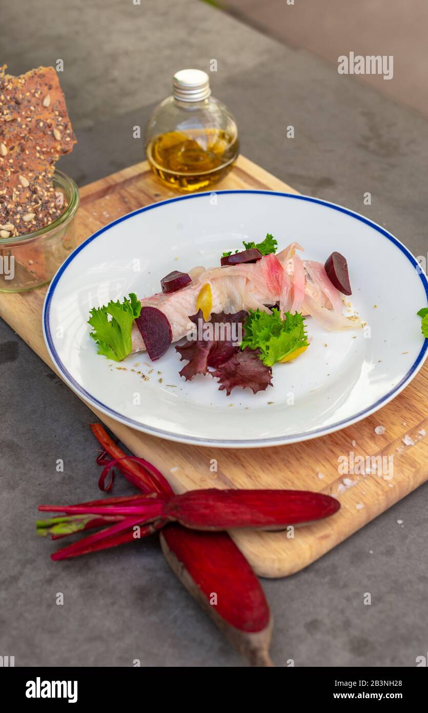 Gourmet salmon starter dish served at rustic Italian restaurant Stock Photo
