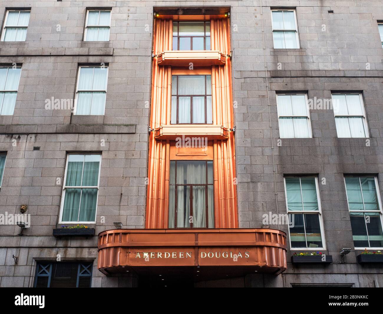 Art deco copper panel above the entrance at the Douglas Hotel on Market Street Aberdeen Scotland Stock Photo
