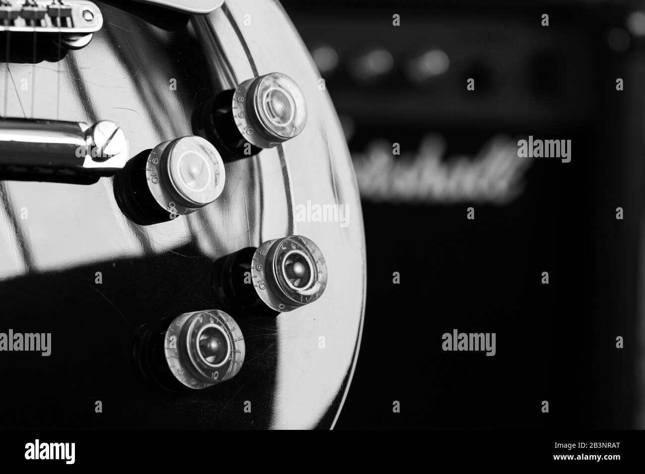 black Electric guitar body with silver pickups , chrome bridge and gold