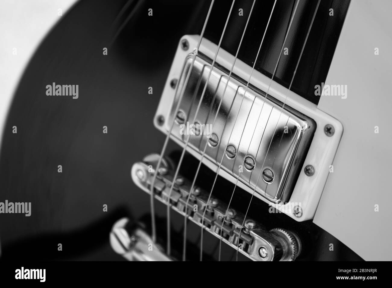 black Electric guitar silver humbucker pickup and bridge Stock Photo
