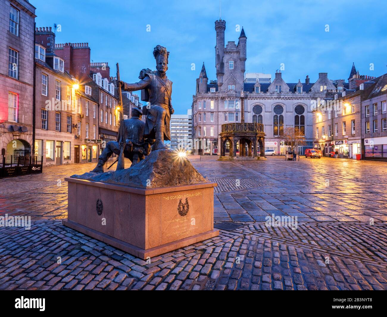 The Gordon Highlanders Statue by sculptor Mark Richards on Castle Street with the Mercat Cross behind in Aberdeen Scotland Stock Photo