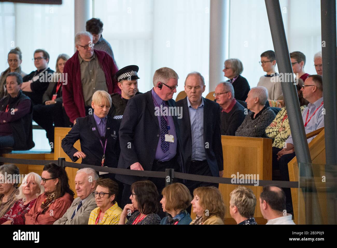 Edinburgh, UK. 5th Mar, 2020. Pictured: A protestor is escorted out of the gallery in the debating chamber during the end of First Ministers Questions. Parliament was suspended whilst the protestor was escorted outside by Police and security. Scenes from First Ministers Questions at the Scottish Parliament in Holyrood, Edinburgh. Credit: Colin Fisher/Alamy Live News Stock Photo