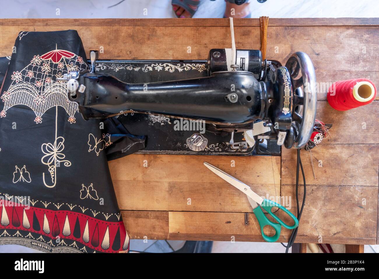 Sewing machine and African fabrics in seamstress Mozambique