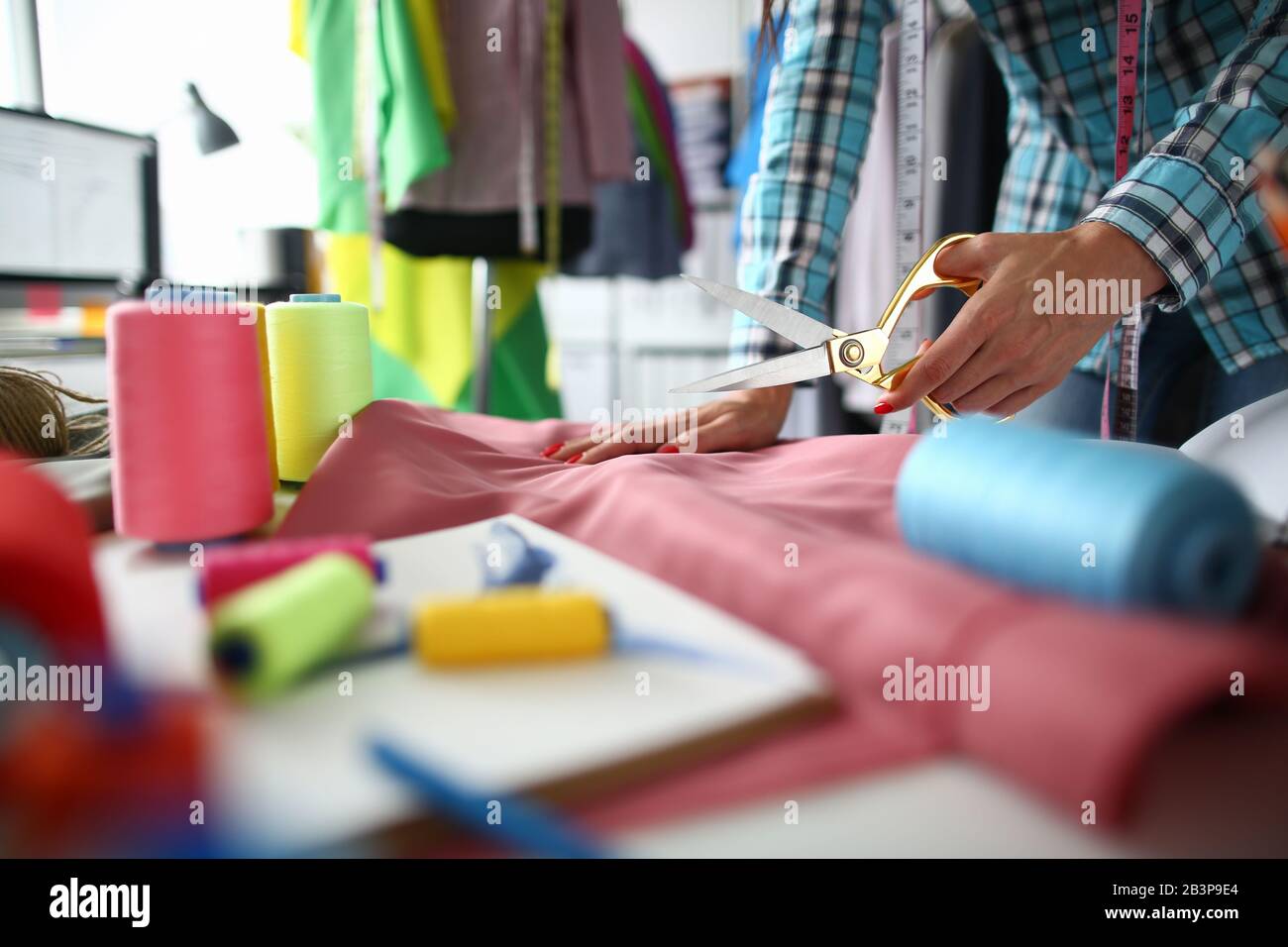 Tailor work with natural fabric in sewing Stock Photo Alamy