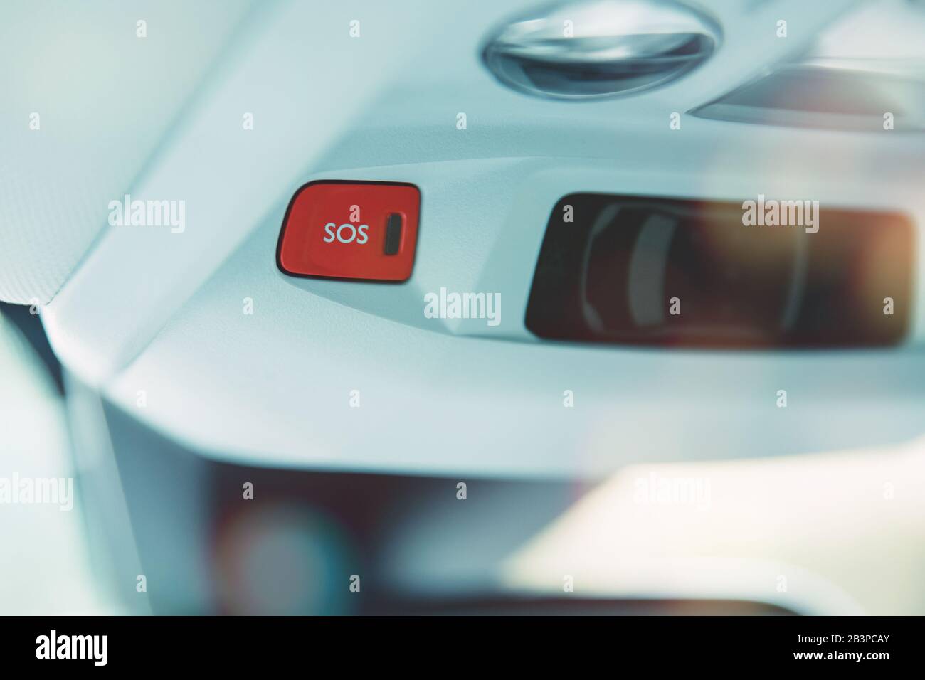 SOS sign in modern car designed to call for help after car accident Stock Photo