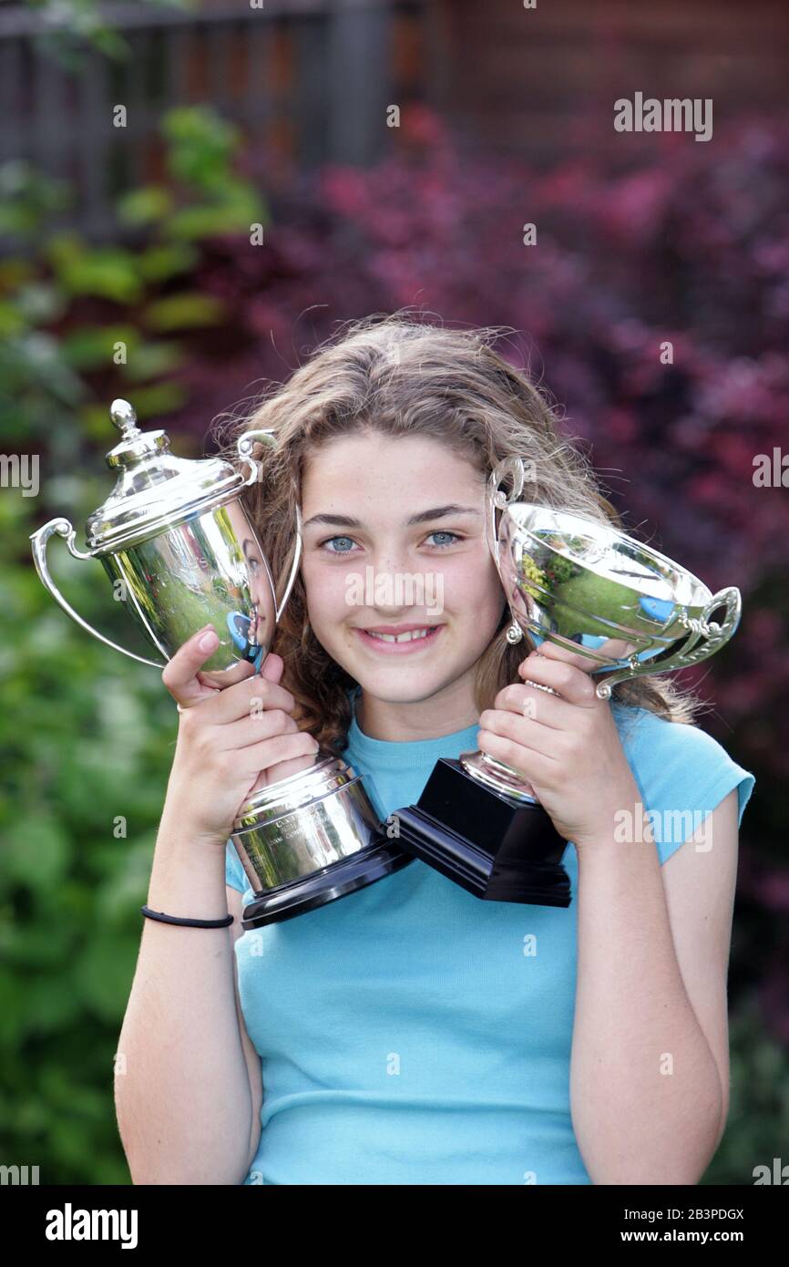 12 year old girl with sports trophy UK Stock Photo Alamy