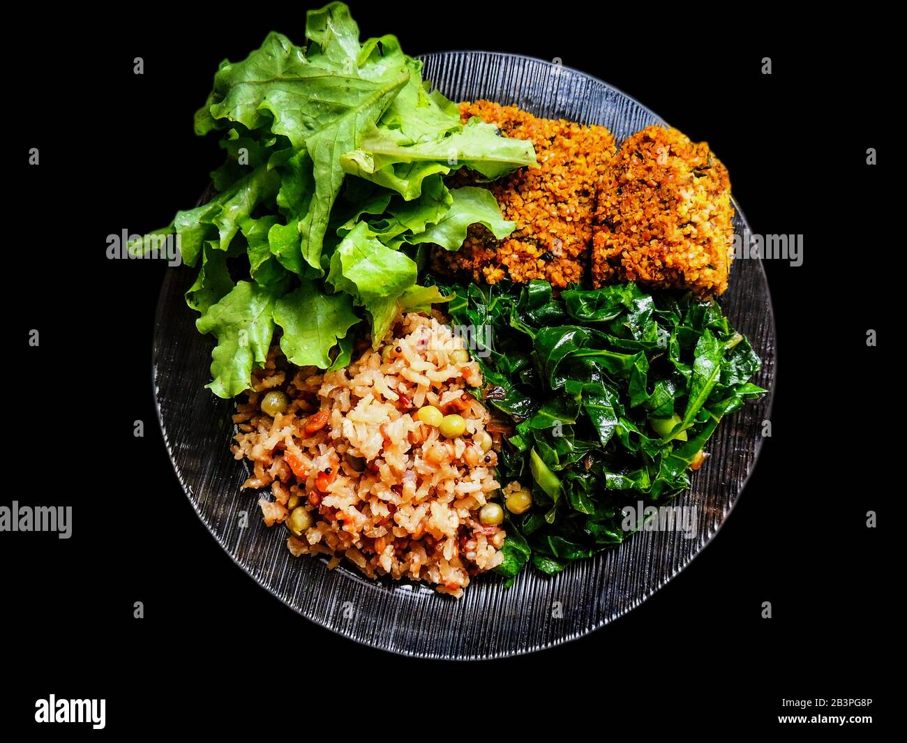 Close-up of a delicious, healthy and tasty vegan meal - Macro - Isolated - black background Stock Photo