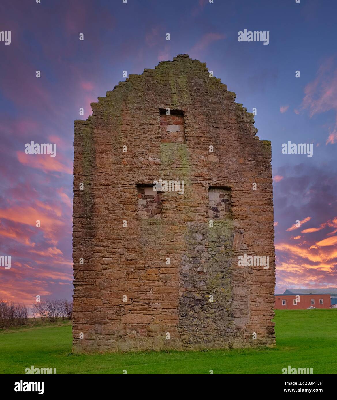 The remains of the old Engine House that served Auchenharvie Colliery in the Ayrshire town of Ardeer in Stevenston North Ayrshire Scotland at sunset Stock Photo