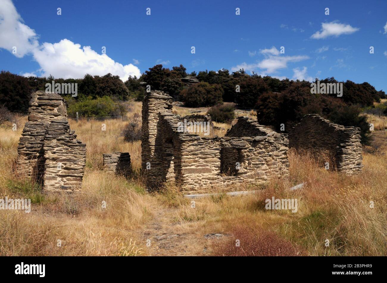 Remains of the gold mining settlement part of the Bendigo Historic Reserve in the Central Otago Goldfield, New Zealand. Stock Photo