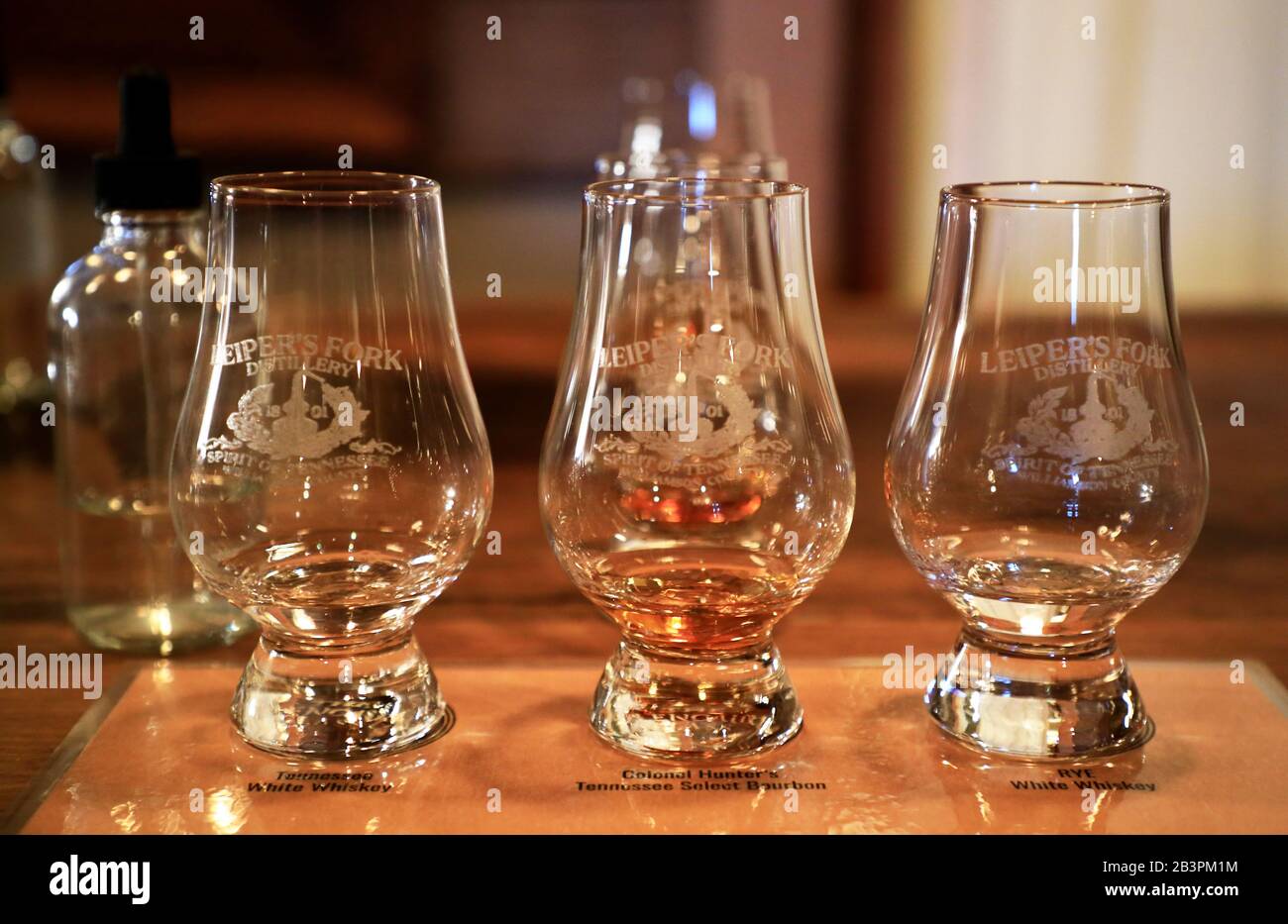 Tasting glasses contain whiskey on the table of tasting room of Leiper's Fork Distillery.Franklin.Tennessee.USA Stock Photo