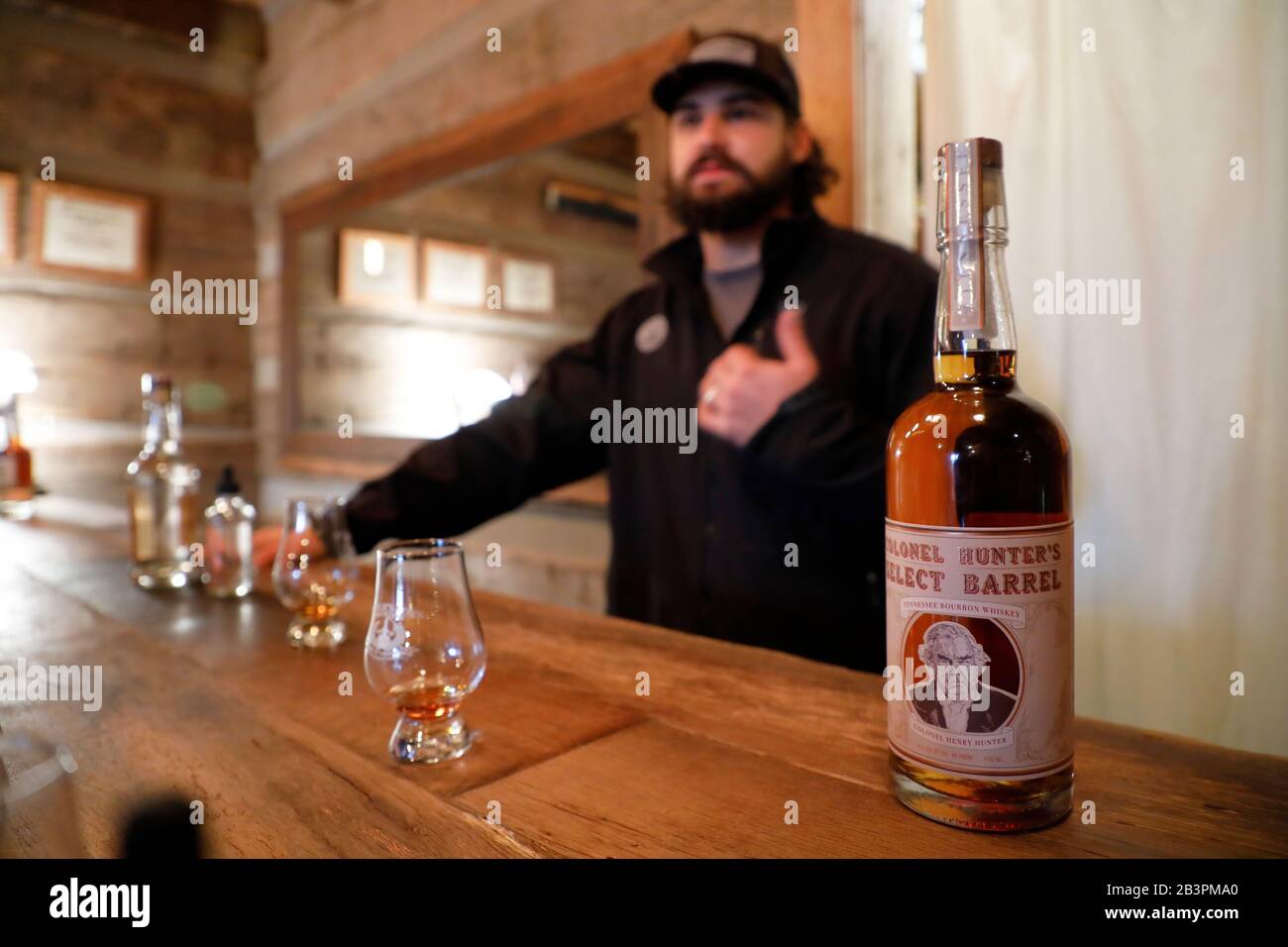 Guide introducing whiskey during a tasting session inside the tasting room in Leiper's Fork Distillery.Franklin.Tennessee.USA Stock Photo