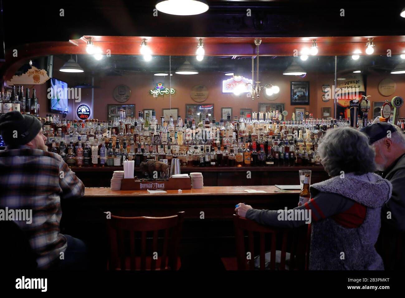 The bourbon bar inside of Old Talbott Tavern with bartender and customers.Bardstown Historic