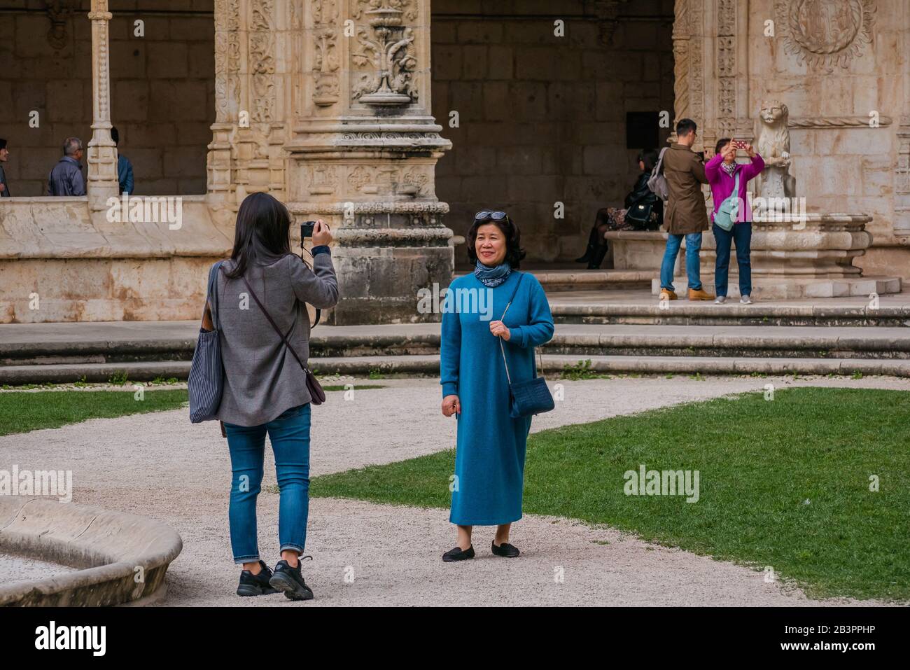Female tourists taking photo inside Jeronimos monastery in Lisbon Portugal Stock Photo