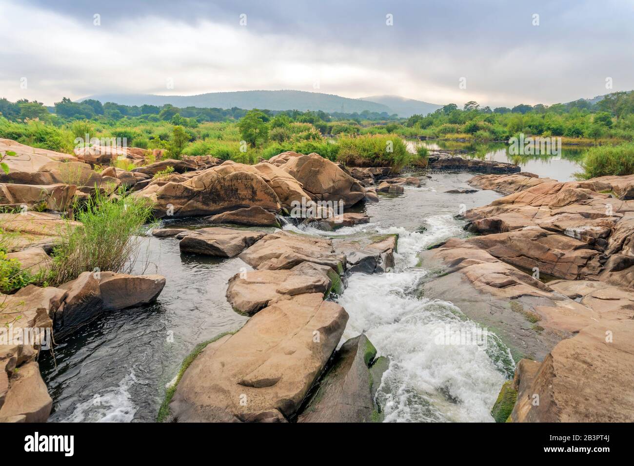Stream with rocks near Crocodile Bridge in Kruger National Park, South Africa Stock Photo
