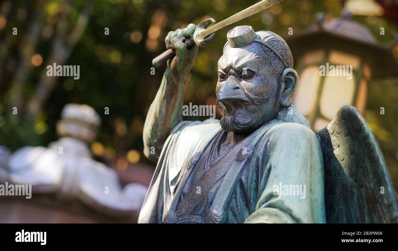 TAKAOMACHI, JAPAN - NOVEMBER 16, 2019: A statue of Tengu, supernatural being from japanese legends Stock Photo
