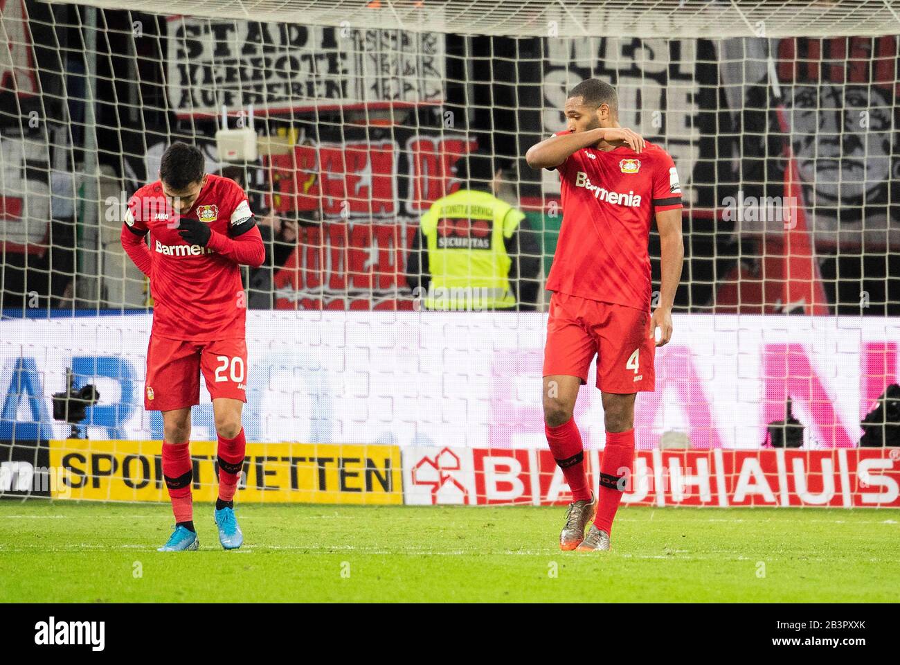 left to right Charles ARANGUIZ (LEV), Jonathan TAH (LEV) disappointed after the goal for 0: 1, soccer DFB Pokal quarterfinals, Bayer 04 Leverkusen (LEV) - Union Berlin (UB), on 04.03.2020 in Leverkusen / Germany. | usage worldwide Stock Photo