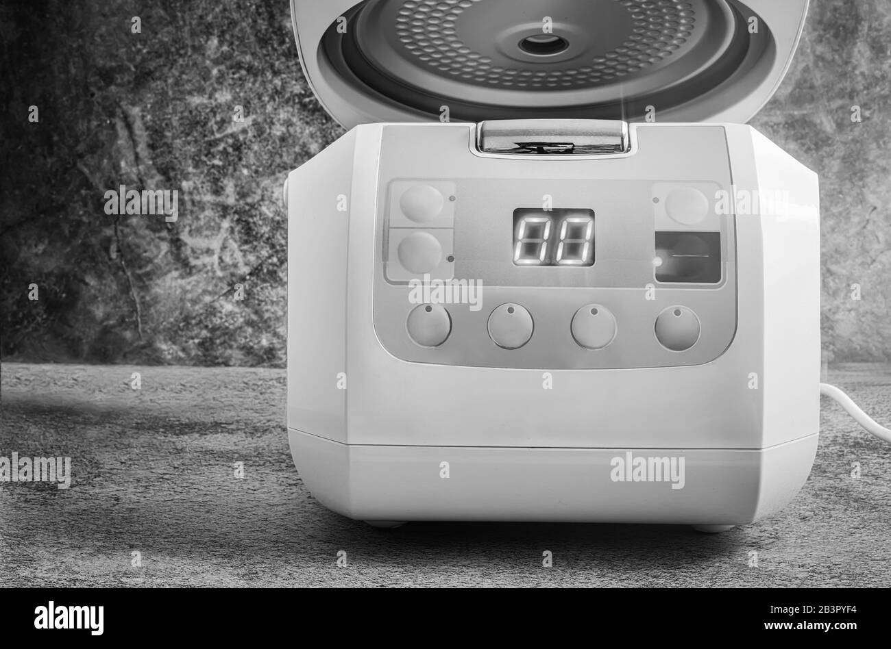 Modern electric multi cooker on the kitchen table Stock Photo Alamy