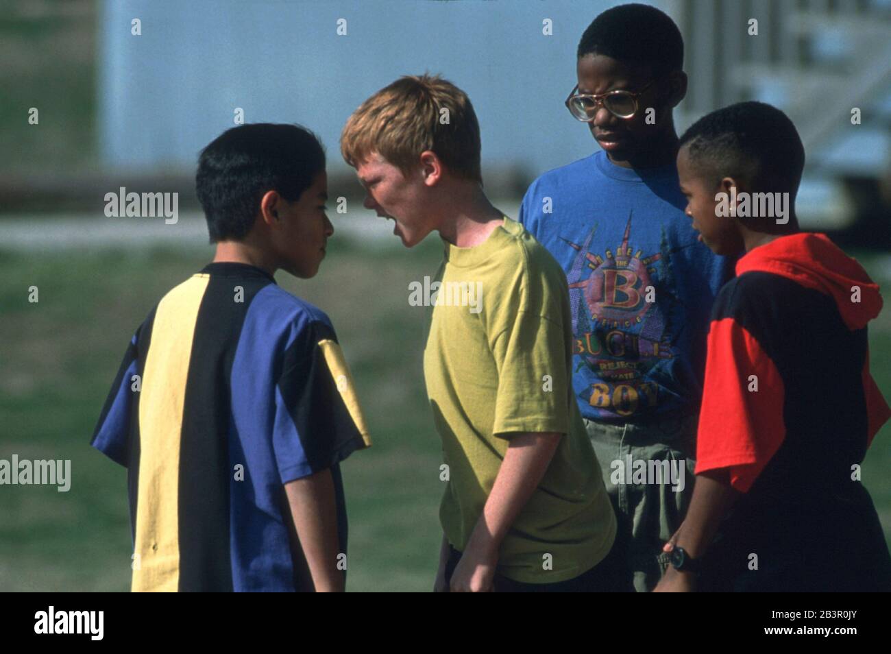 Austin Texas USA, circa 1995: Young boys arguing on school playground. ©Bob Daemmrich Stock Photo