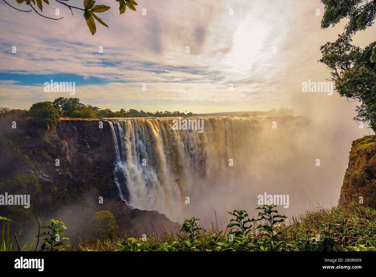 Sunset at the Victoria Falls on Zambezi River in Zimbabwe Stock Photo