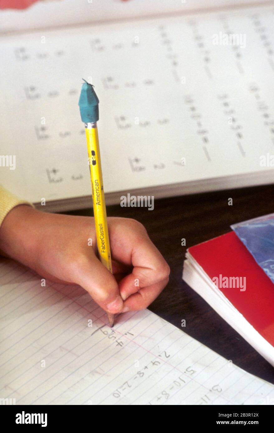 Lefthanded student writing in math class. ©Bob Daemmrich Stock Photo