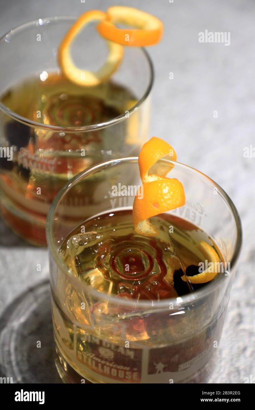 Two glasses of Old Fashioned whiskey cocktail served in the bar in Jim