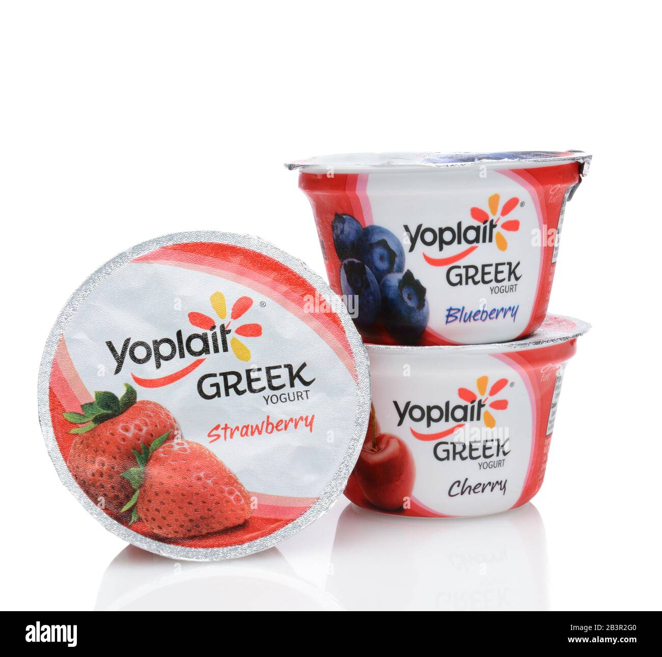 IRVINE, CA - SEPTEMBER 15, 2014: Three containers of Yoplait Greek Yogurt, Cherry, Strawberry, and Blueberry. In 1965, two French dairy co-operatives, Stock Photo