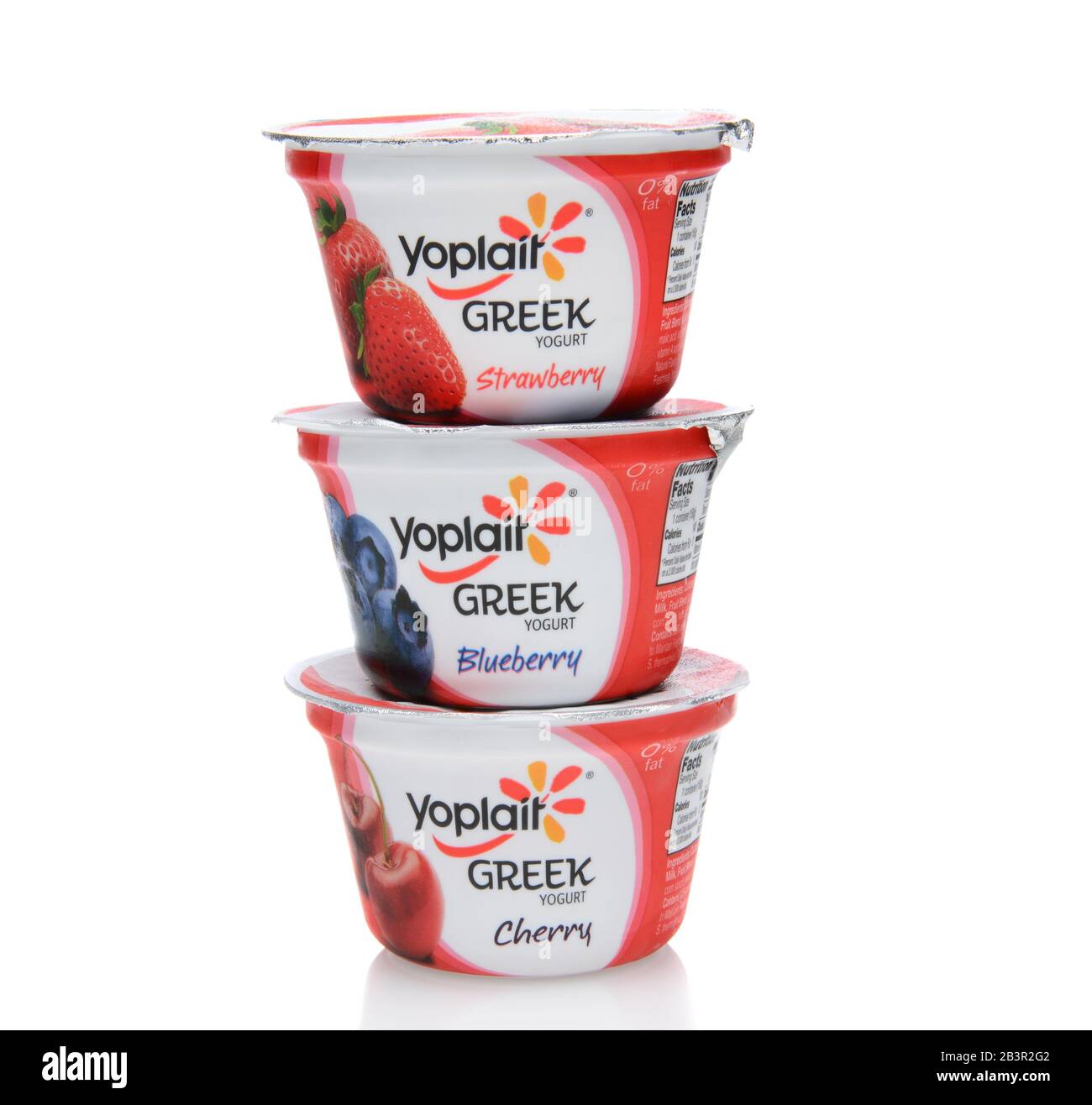 IRVINE, CA - SEPTEMBER 15, 2014: Three different containers of Yoplait Greek Yogurt. In 1965, two French dairy co-operatives, Yola and Coplait, merged Stock Photo