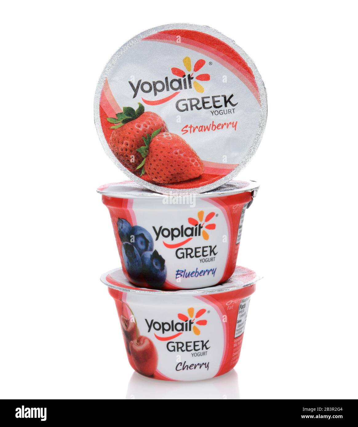 IRVINE, CA - SEPTEMBER 15, 2014: A stack of three different containers of Yoplait Greek Yogurt. In 1965, two French dairy co-operatives, Yola and Copl Stock Photo