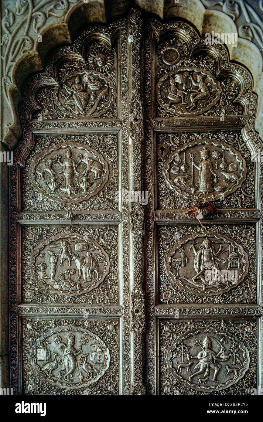 05 Mar 2020 God and Goddess embossed on silver door of Karni mata temple Bikaner Rajasthan India Stock Photo