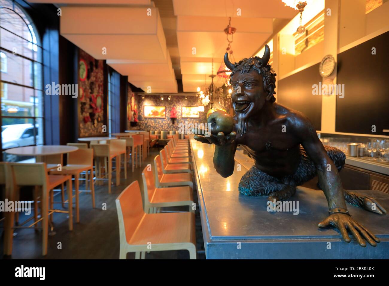 The Devil statue decorating the bar inside of Proof on Main the