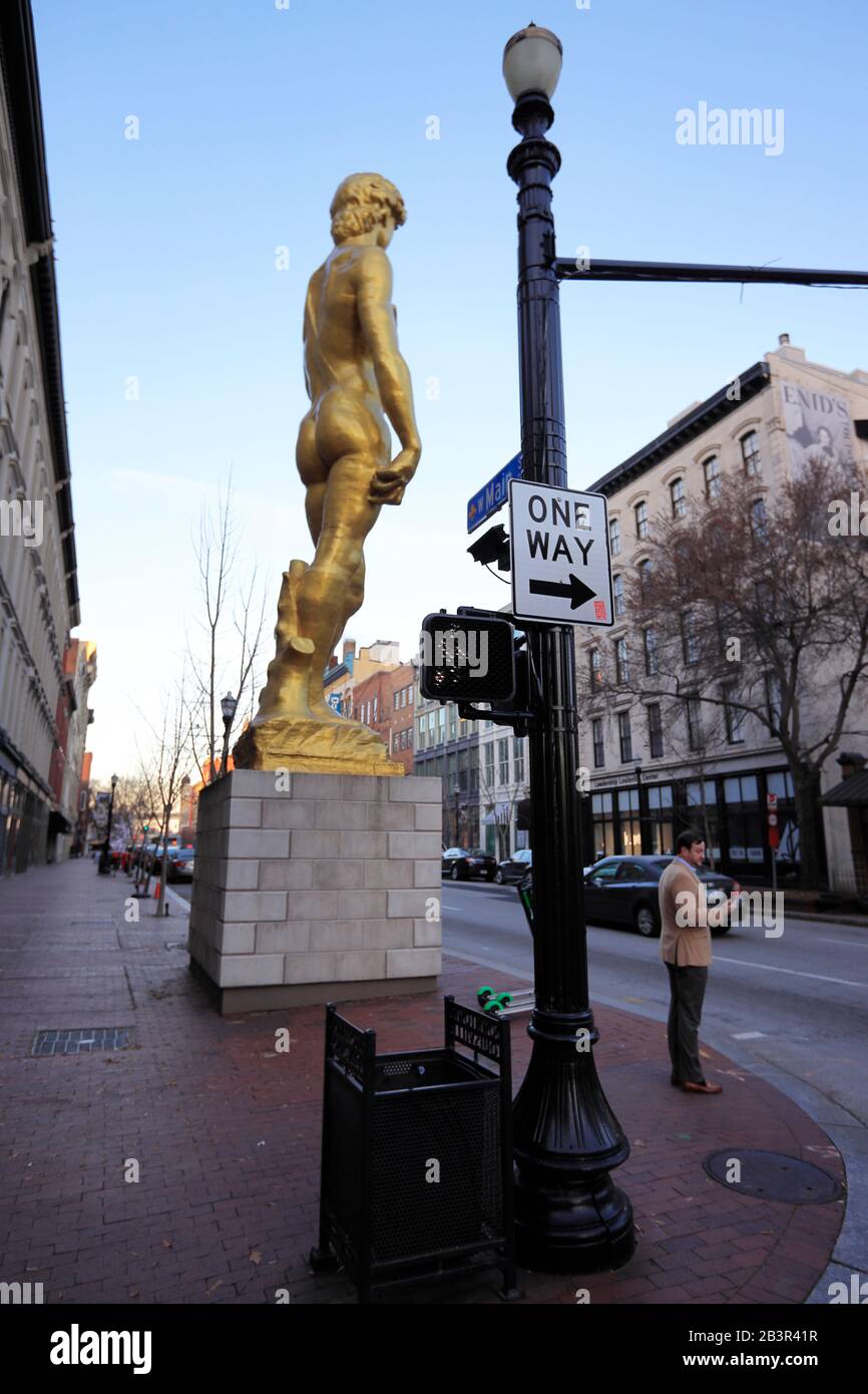 The gold statue of David outside of 21c Museum Hotel by Serkan Ozkaya