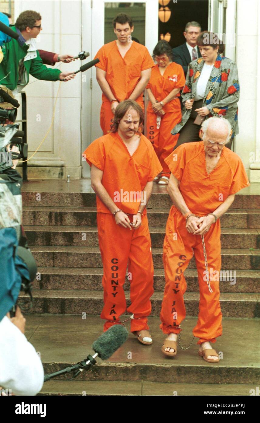 Waco Texas USA, April 29 1993: Members of the Branch Davidian religious sect leave a court hearing wearing county jail jumpsuits, ankle restraints and handcuffs at the federal courthouse in Waco. The prisoners survived the deadly fire at the Branch Davidian compound that killed 76 members of the religious sect and ended a 51-day siege by government law enforcement on the property. ©Bob Daemmrich Stock Photo