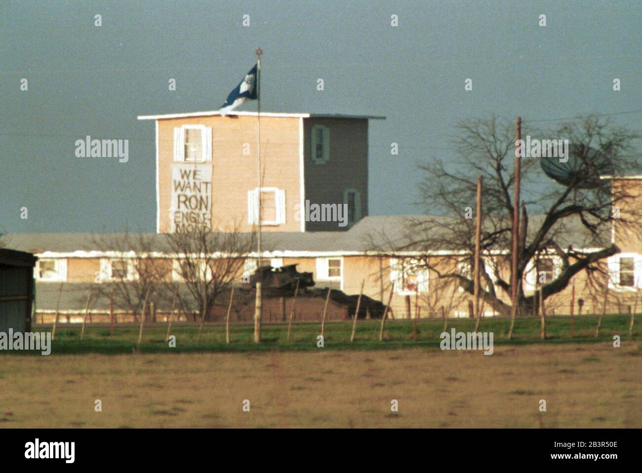 Waco Texas USA, March 1993: A U.S. Army tank drives past the Branch Davidian compound near Waco, Texas during the 51-day standoff between sect members and federal law enforcement agents. ©Bob Daemmrich Stock Photo