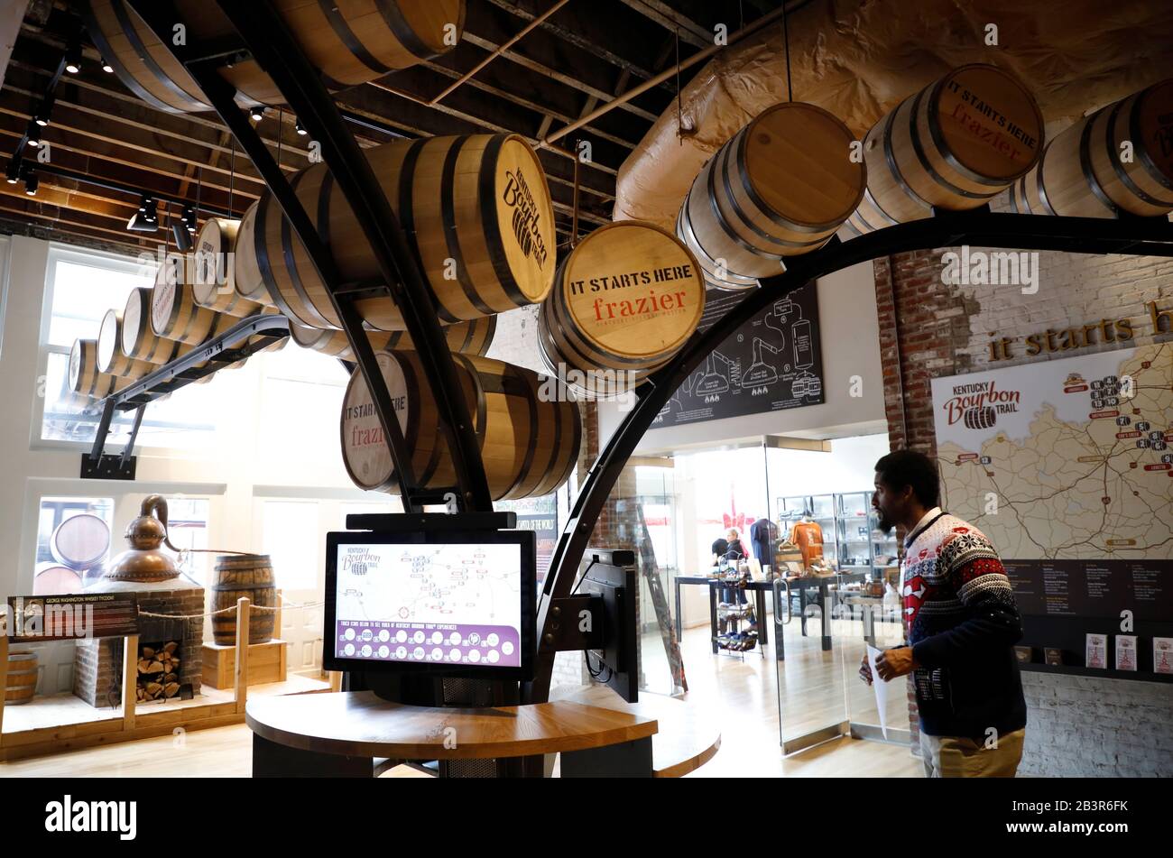 Visitors inside of Frazier History Museum with whiskey barrels.the starting point of Kentucky Bourbon Trail.Louisville.Kentucky.USA Stock Photo