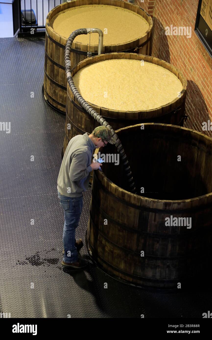 A worker is checking fermentation barrels at Michter's Fort Nelson Distillery. Louisville.Kentucky.Kentucky Bourbon Trail.USA Stock Photo