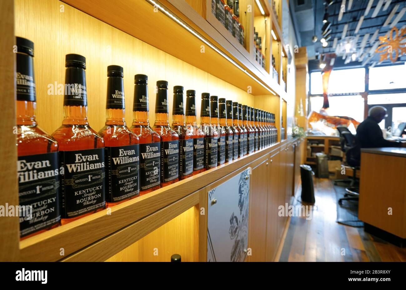 Bottles of Evan Williams bourbon whiskey displaying on the shelf in the reception of Evan
