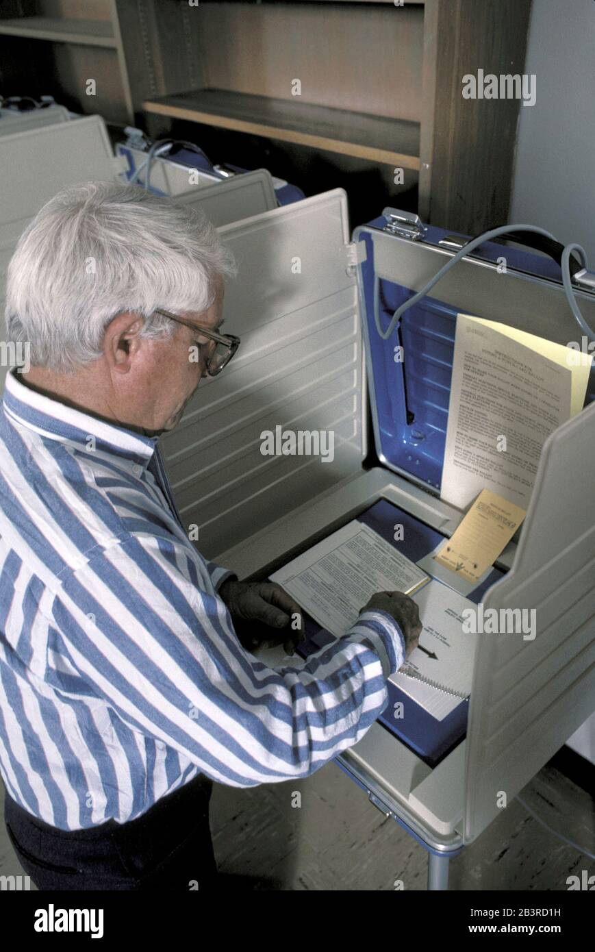 Austin, Texas USA, circa 1996: Elderly Texan voting in constitutional election using paper ballot.  ©Bob Daemmrich Stock Photo